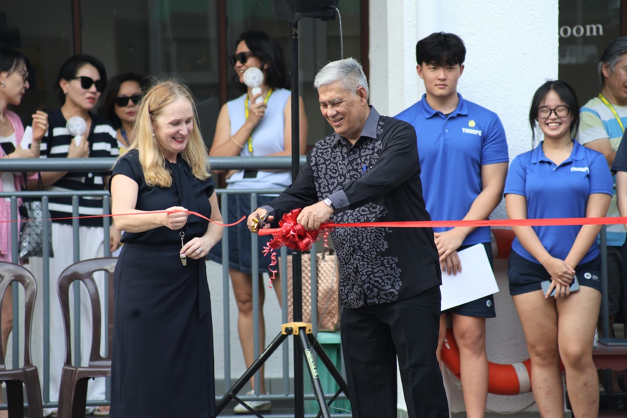 Ribbon-cutting ceremony at the Australian International School Malaysia pool reopening celebration, bringing together the AISM community.