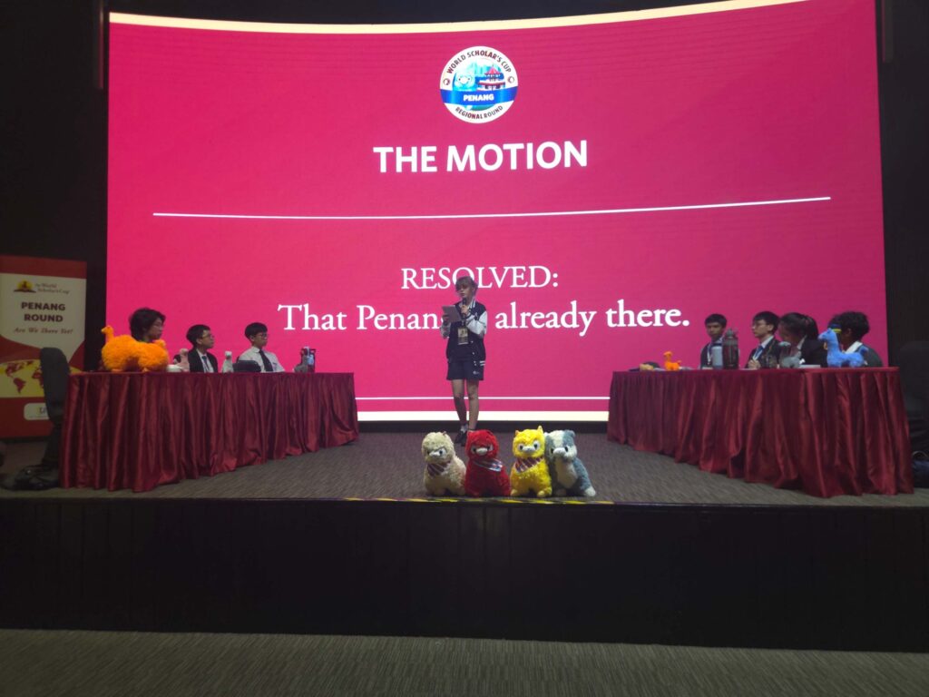 AISM students competing in a World Scholar’s Cup debate at the Penang Regional Round 2026