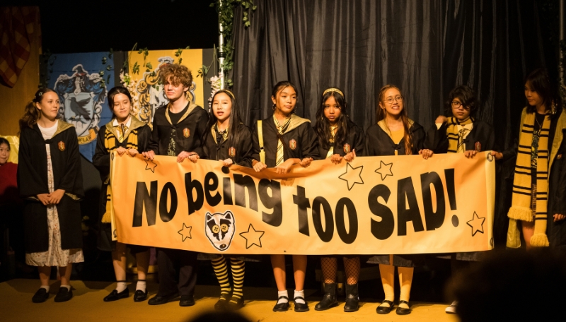 Students performing a scene from Puffs at Australian International School Malaysia